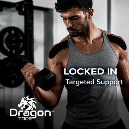Athlete wearing Dragon Tape black kinesiology tape on shoulders during strength training.