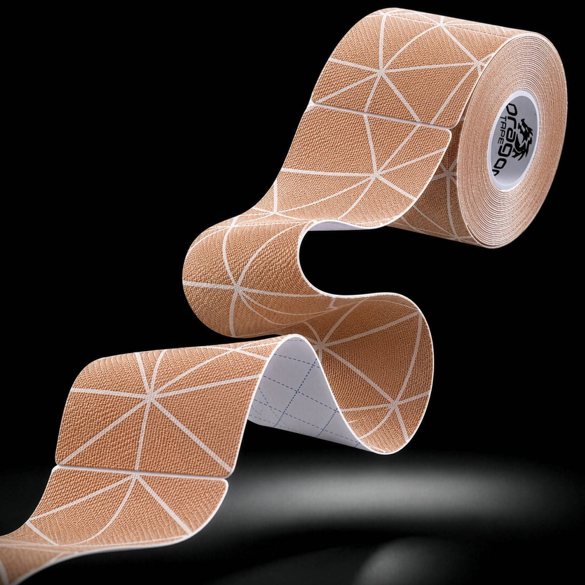 Dragon Tape copper-infused beige kinesiology tape roll and strip with geometric pattern.