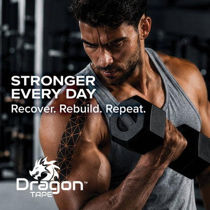 Male athlete lifting weights with Dragon Tape copper infused kinesiology tape on shoulder for workout support.