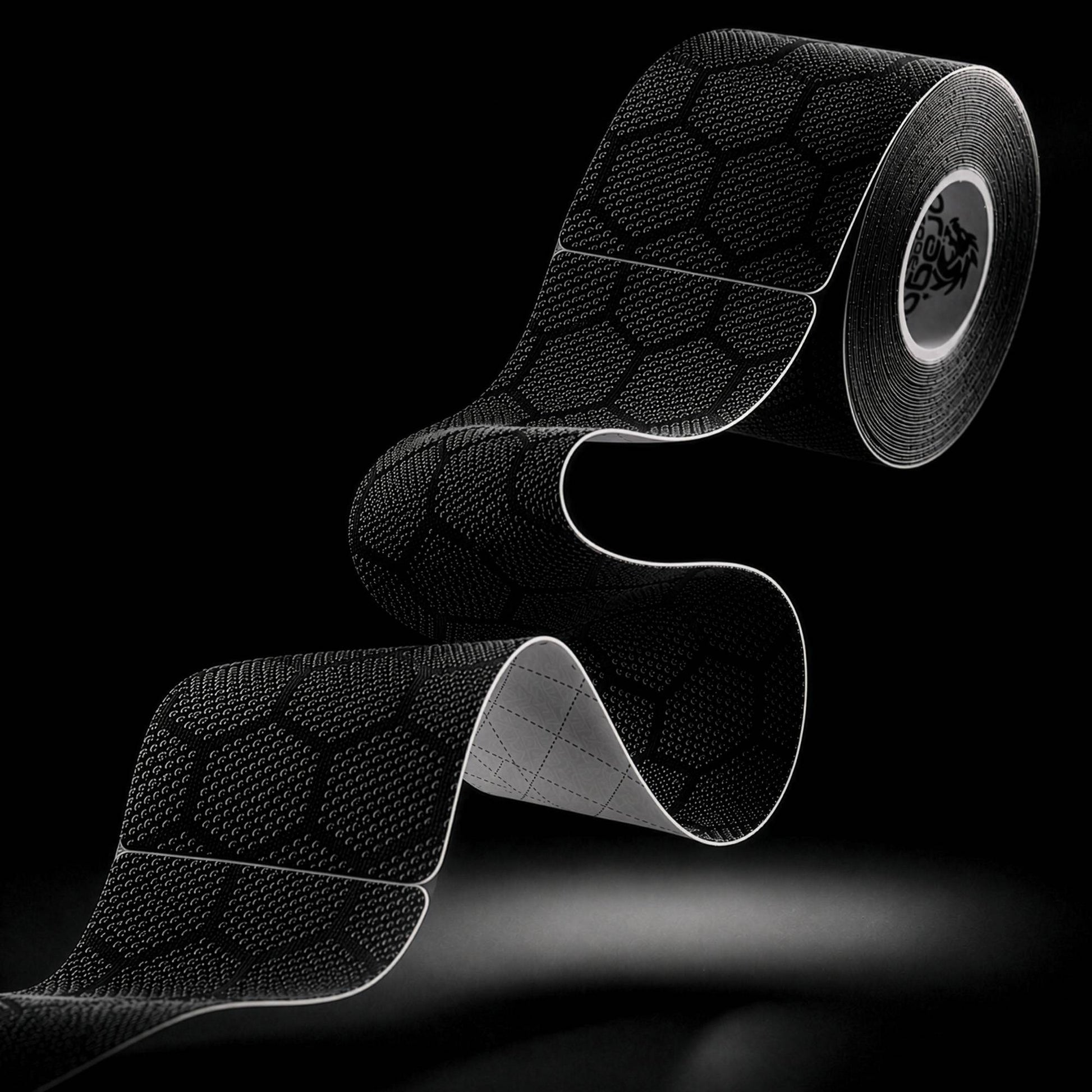Dragon Tape pro-grade synthetic black kinesiology tape roll and strip with hex pattern.
