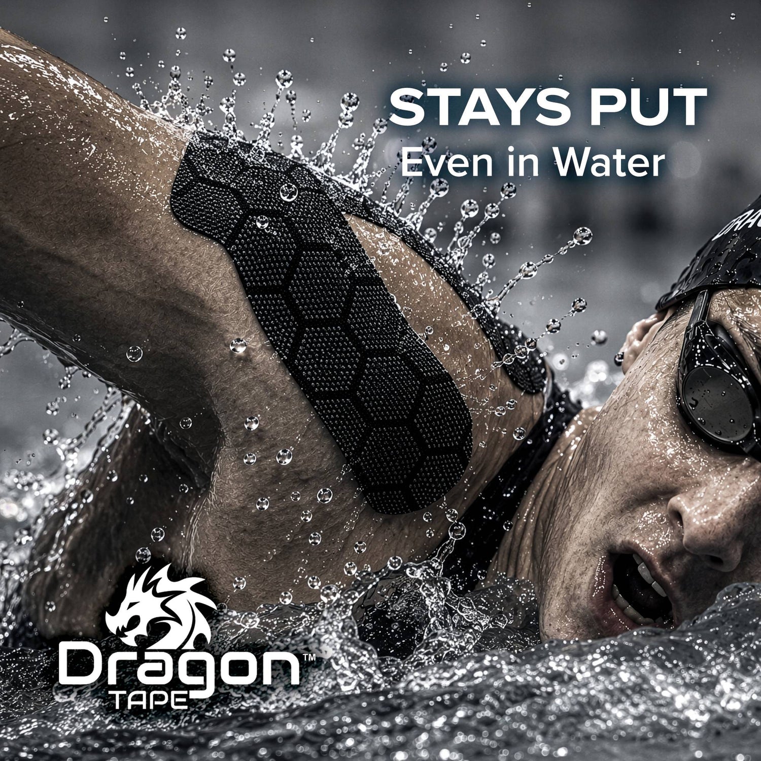 Dragon Tape black kinesiology tape on swimmer’s shoulder, designed to stay put even in water.