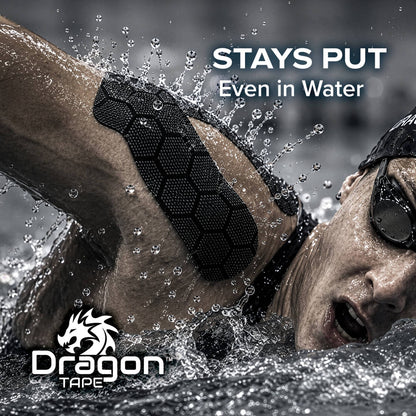 Dragon Tape black kinesiology tape on swimmer’s shoulder, designed to stay put even in water.